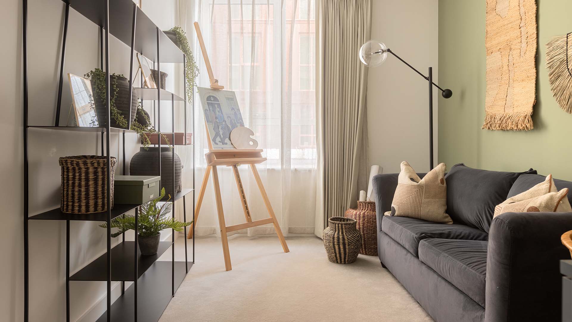 Easel and shelves in stylish apartment at Fulton & Fifth