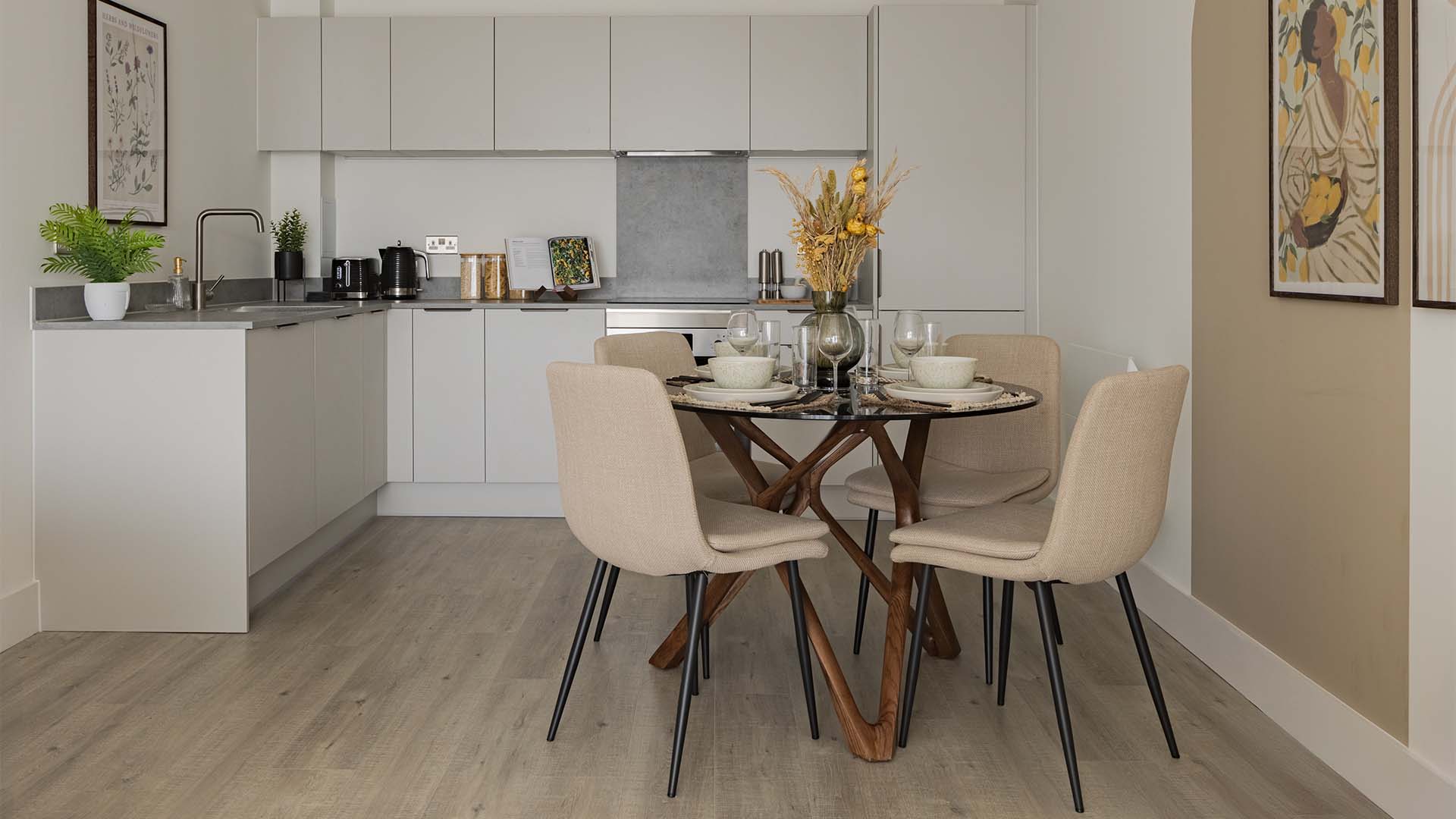 Modern kitchen with dining table set at London Square Watford