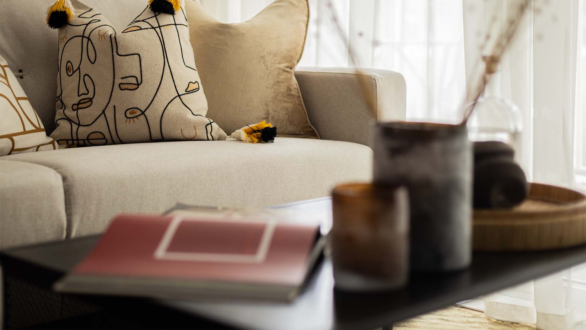 Modern sofa with book and vase decor of 10 Verdica show flats