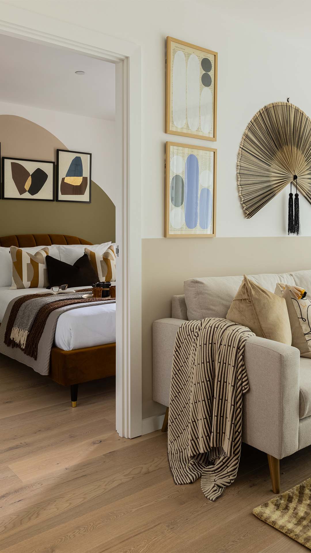 Open living space with sofa and bed of 10 Verdica show flats