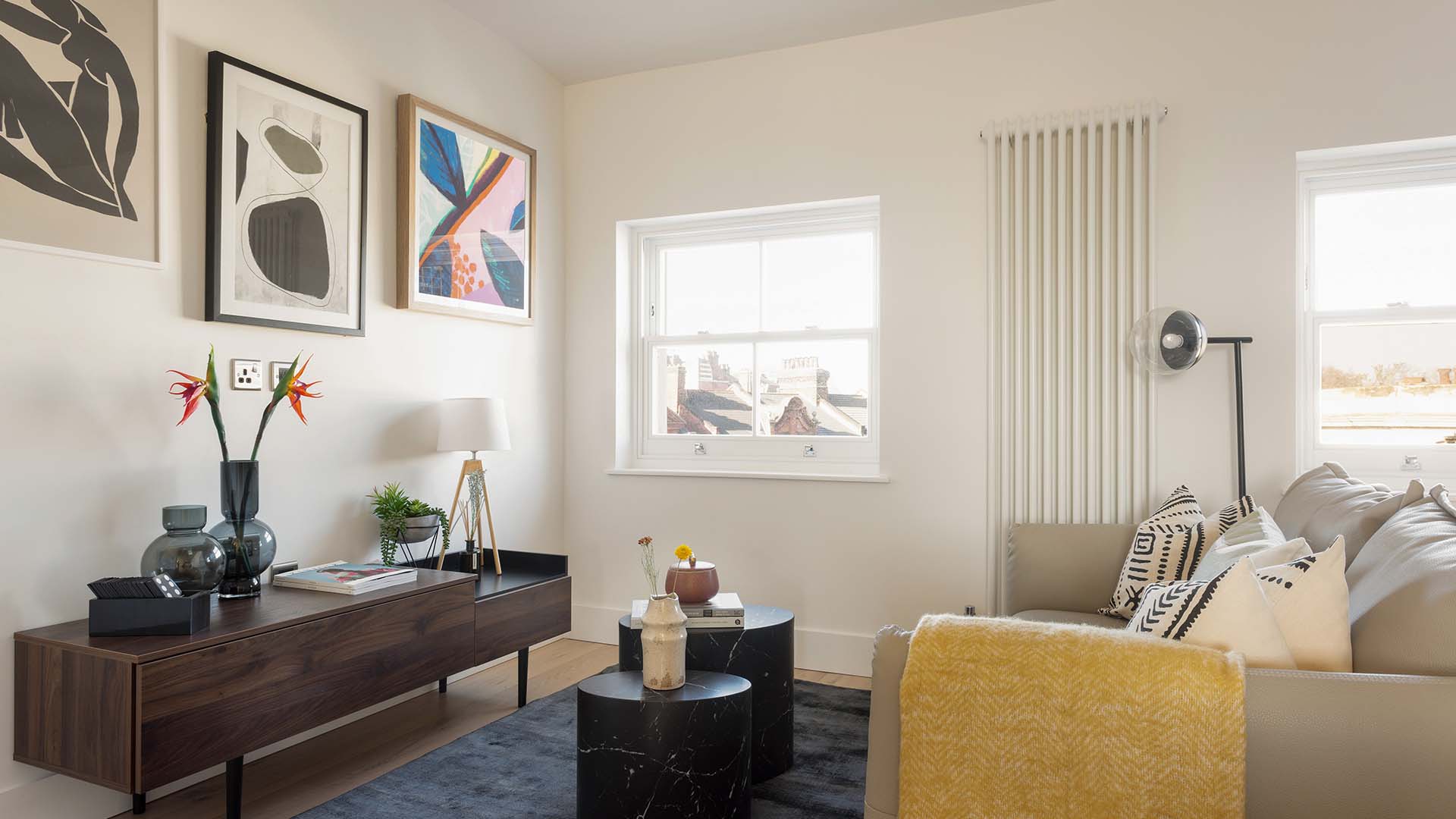 Stylish Living Area with Modern Art, Light & Elegant Furnishing